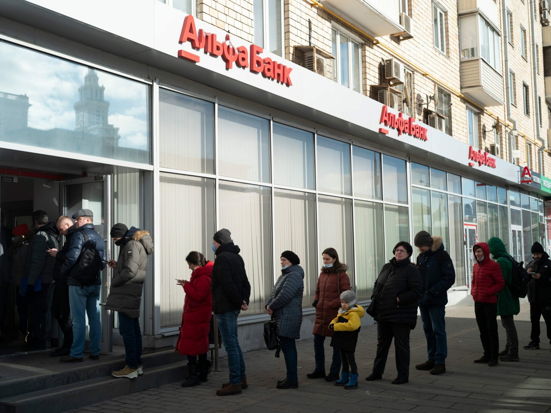 Russian in line to withdraw from ATM, Moscow, March 5